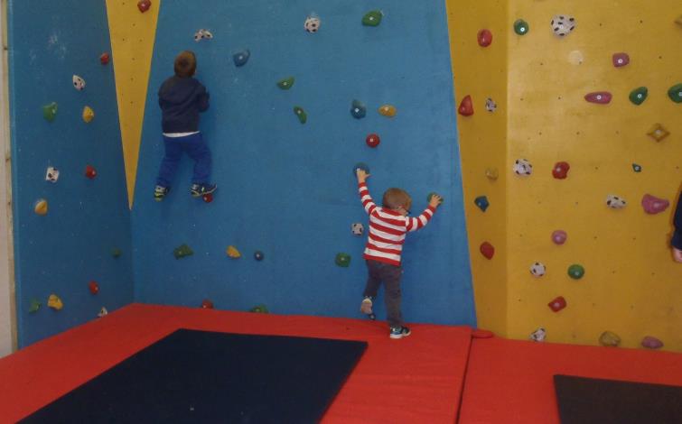 Having fun on the indoor climbing wall